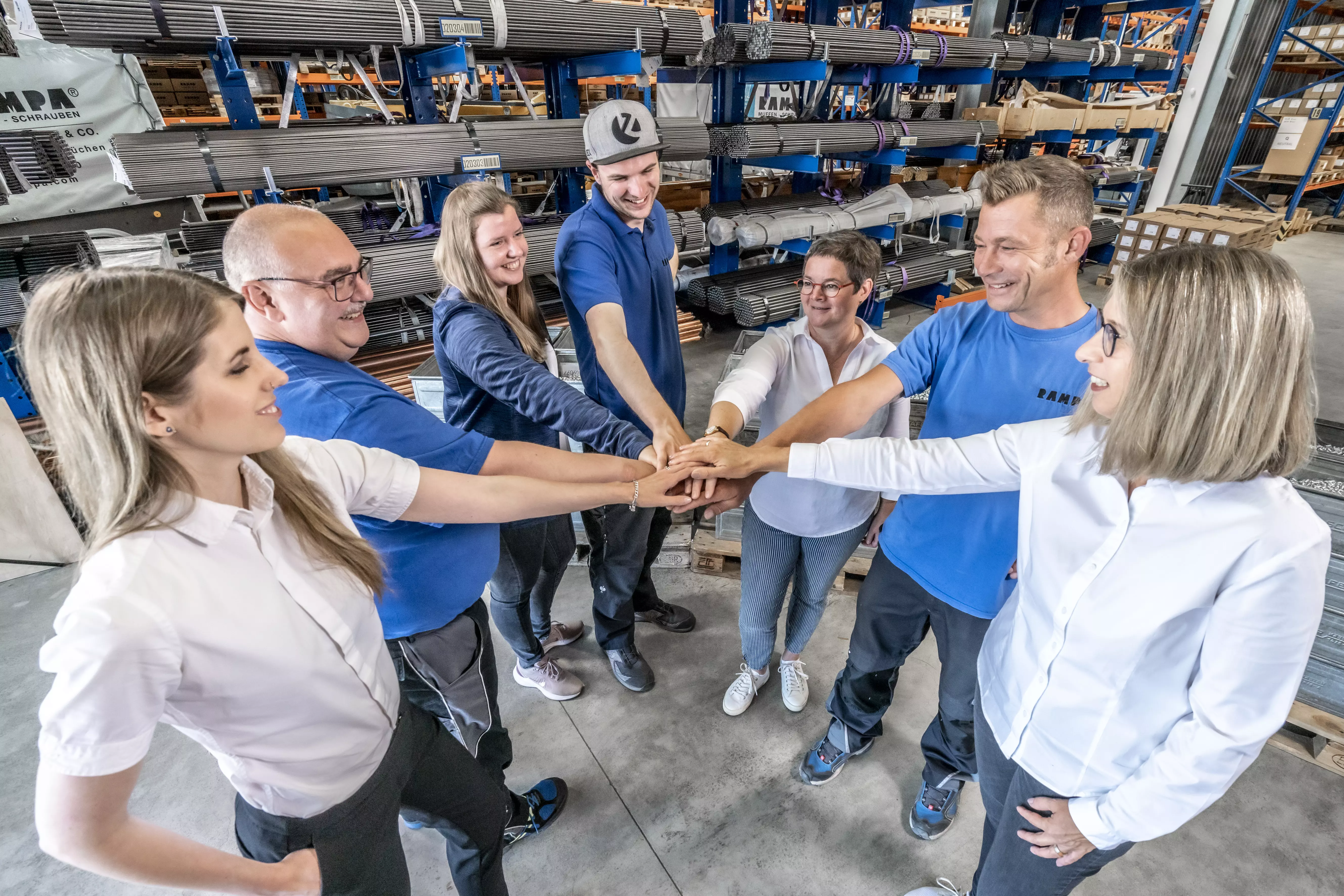 RAMPA's employees focus on team spirit in their everyday work. This message is to be transported by bringing the hands of different people together in the center.