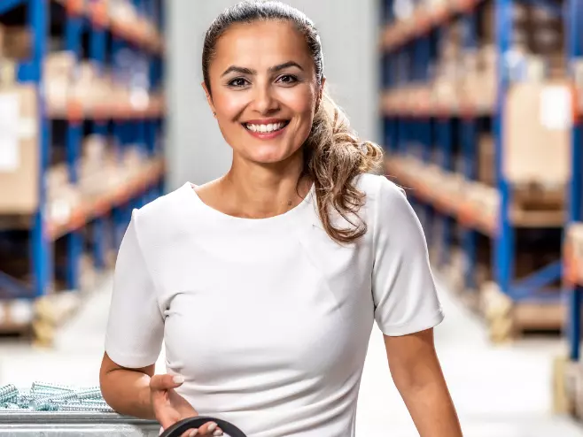 A RAMPA employee representing the Sales team with headset in hand can be seen, with the warehouse in the background.