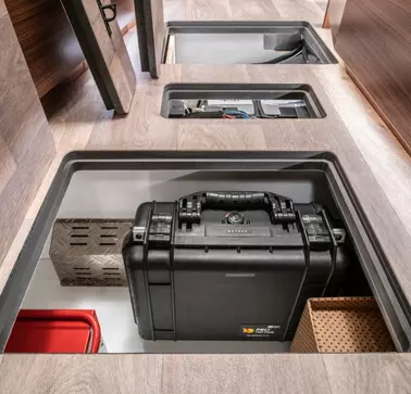 Hymer is a reference partner of RAMPA. The close-up shows the storage spaces in the floor of Hymer's mobile home. In this vehicle, numerous RAMPA inserts have been used for the interior fittings.
